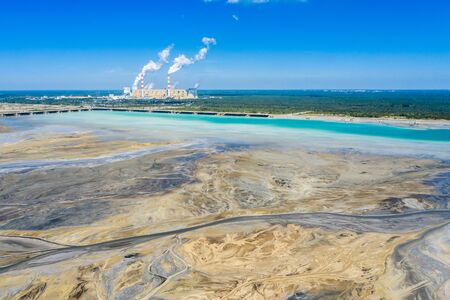 Surface coal mining and power station in Poland. Destroyed land. View from above. Surrealistic landscape.の写真素材