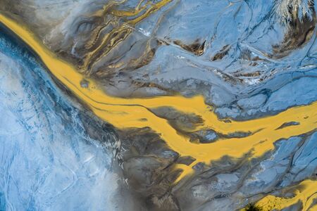 Degraded landscape. Destroyed land. View from above. Surrealistic lake.Human impact on the environment. View from above. Photo captured with droneの写真素材