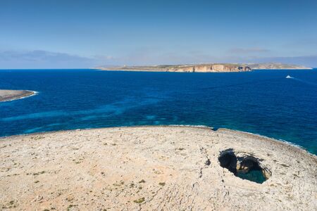 Big natural hole in the rock. Coral Lagoon. Malta island