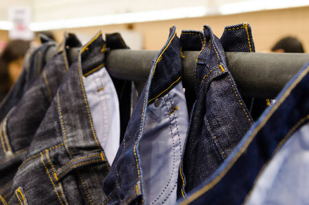 jeans with hanging rail in a fashion store