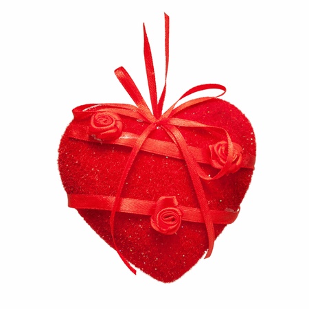 Red heart of fabric and satin, decorated with flowers. Hand Made. Gift with love.  Isolated on white backgroundの写真素材