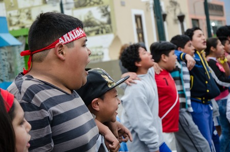 Lima, Peru - OCTOBER 10th 2017: Fanaticism in Peru (Peru vs. Colombia) Russia 2018. Children singing with great force of the National Anthem of Peru before the matchのeditorial素材