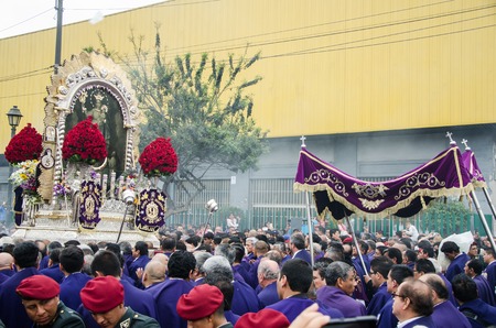Lima, Peru - OCTOBER 28th 2017: Procession of the Lord of Miracles. As every year, the devotees accompany the dark-haired Christ through the streets of downtown Limaのeditorial素材