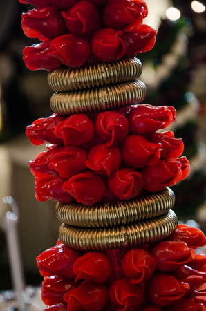 Red chocolate candies in the shape of a roseの写真素材