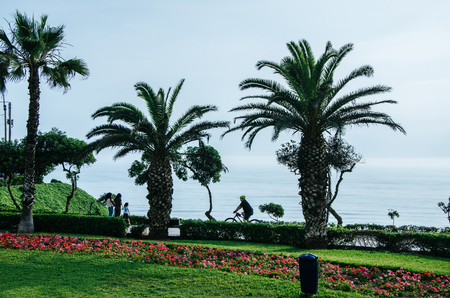 People walking along the coast of Lima as any dayの写真素材
