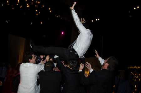 Groom in the air, funny moments of a weddingの写真素材
