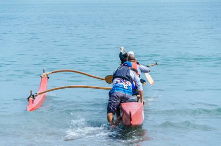 Kayaking concept with group of men and women swimming in the sea on a summer day.の写真素材