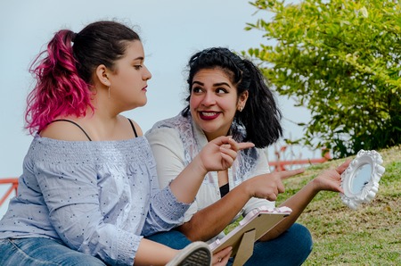 Portrait of women working outdoors making decisions for some objects