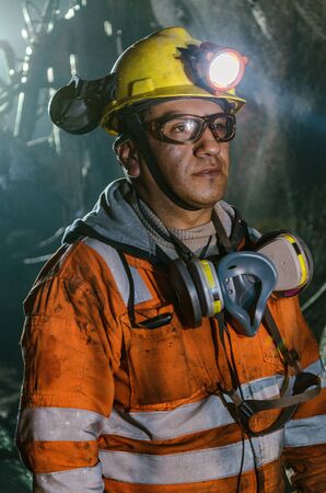 Cerro de Pasco, Peru - July 14th 2017: Miner in the mine. Miner inside the mine well uniformed with a look of confidence.のeditorial素材