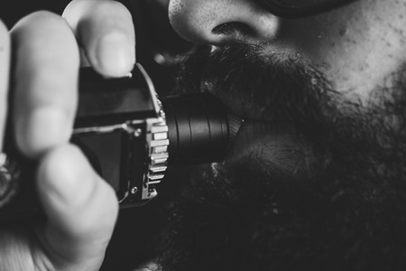 Close up of an unrecognizable young man smoking from a vape pen or vaporizerの写真素材