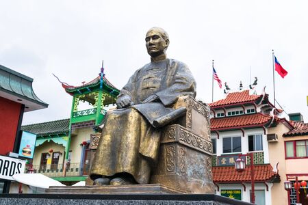 LOS ANGELES, USA - FEBRUARY 18, 2017: The East Gate entrance to Los Angeles Chinatown in sunny california. Dr Sun Yat-sen sitting statue in the central plaza.のeditorial素材