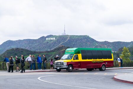 LOS ANGELES, USA - FEBRUARY 19, 2017: View of the Hollywood poster. Some tourists enjoy the stayのeditorial素材