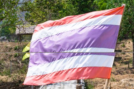 Thailand flag on the longest wooden bridge in Pai - Thailandの写真素材