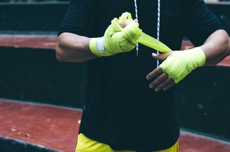 Boxer bandages around their arms ready to fightの写真素材