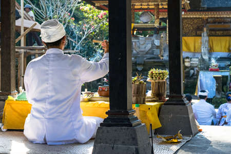 Bali, Indonesia 27 june 2017 : Buddhists praying at Tirta Empul temple in Bali, Indonesia. It has holy water where Hindu Bali people go for purification rituals.のeditorial素材