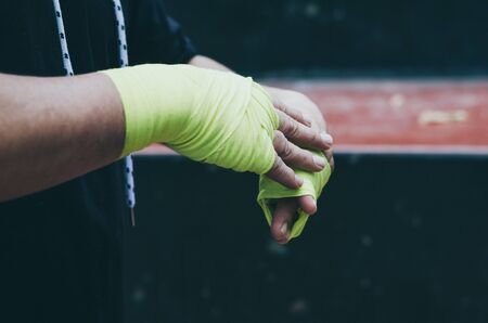 Boxer bandages around their arms ready to fightの写真素材