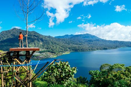 Azure beach with rocky mountains and clear water of Indian ocean at sunny day, A view of a cliff in Bali Indonesiaの写真素材
