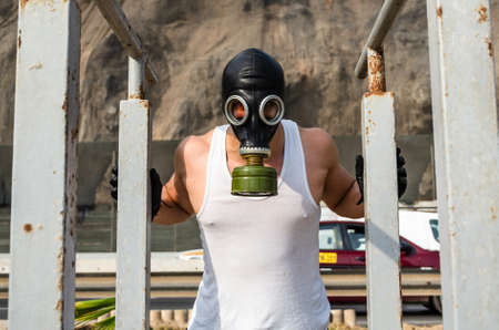 athletic man in a protective mask at practice in the morning.の写真素材