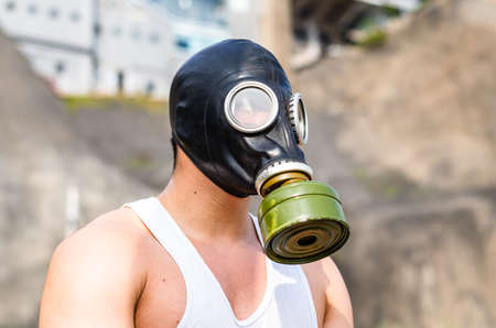 A muscular man in a gas mask.の写真素材