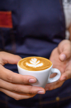Latin Woman Barista Working Holding Coffee Cup At Cafe Working woman small business owner or sme...
