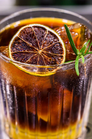 Espresso, layered passion fruit juice in transparent glass with ice.