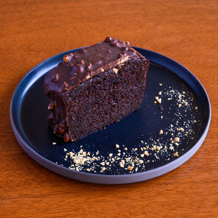 Decadent chocolate cake slice on plateの写真素材