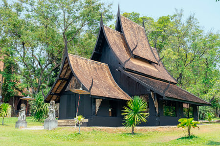 Traditional thai architecture in lush green parkの写真素材