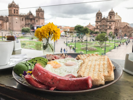Enjoying breakfast with a view of plaza de armas in cusco, peruの写真素材