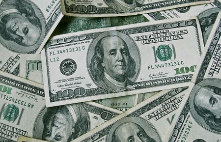 hundred dollar bills money pile