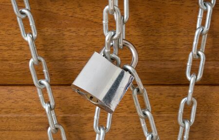 wooden gate locked in chains