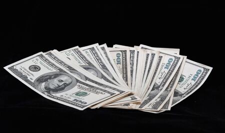 Dollar on a black background の写真素材