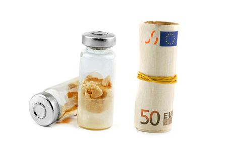 medication pharmaceutics, medical ampoules on money isolated の写真素材