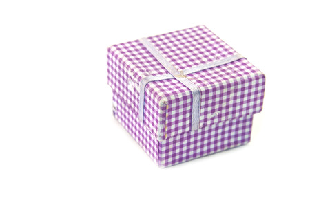 violet gift box with bow isolated on a white background の写真素材