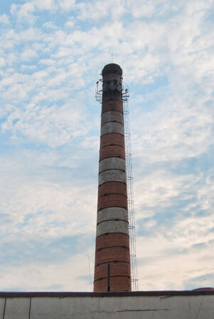 Industrial Old Brick Chimney without smoke, on blue skyの写真素材