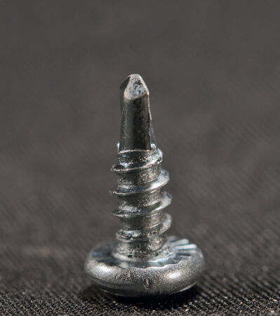 screw on gray backgroundの写真素材