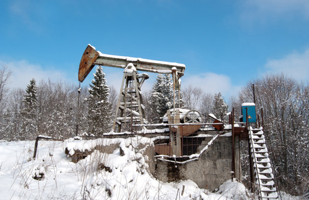 oil wells are drilling oil at winterの写真素材