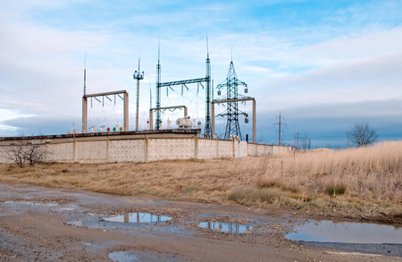 substation with plowed field on sky background