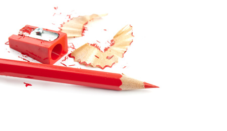 red pencil and sharpener isolated on whiteの写真素材