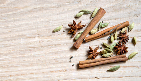 star anise, cinnamon stick and cardamom on a wooden backgroundの写真素材