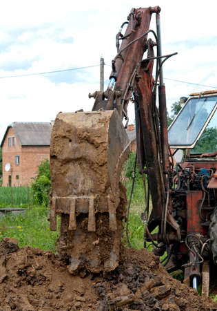 working with excavator at road construction site