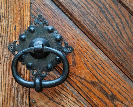 antique doorknob on a wooden door