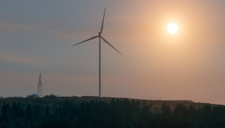windmill against cloudy sky. Sunsetの写真素材