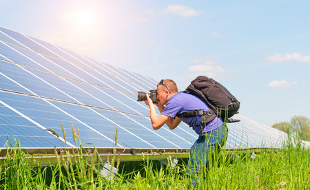 photographer takes pictures of solar panels