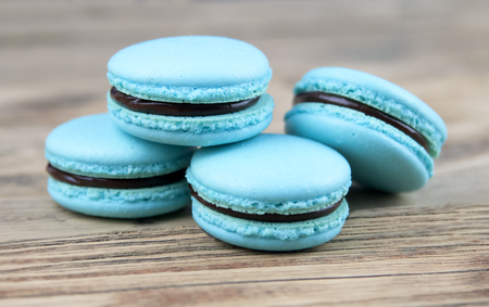 tasty french macarons on a wooden tableの写真素材