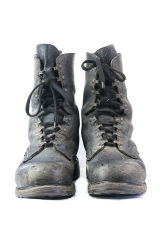 dirty military boots  isolated on whiteの写真素材