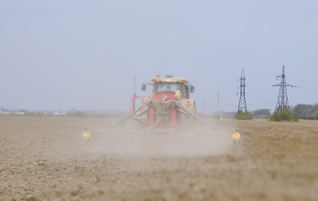 farmer seeding, sowing crops at fieldの写真素材