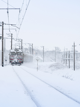train station at winter with train in motionの写真素材