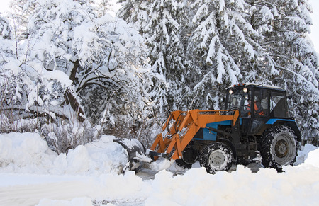 removing snow from the road in winter