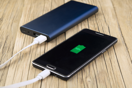 Phone charging with energy bank. Depth of field is Power Bankの写真素材