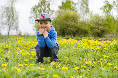 little boy in flowers field. Aclose upの写真素材